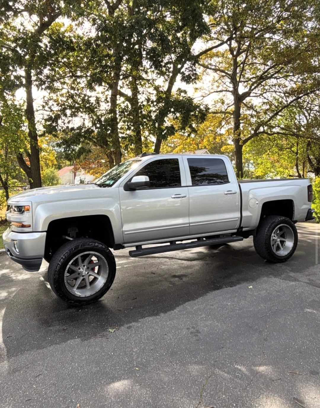 Silver Chevy Silverado lifted truck detail