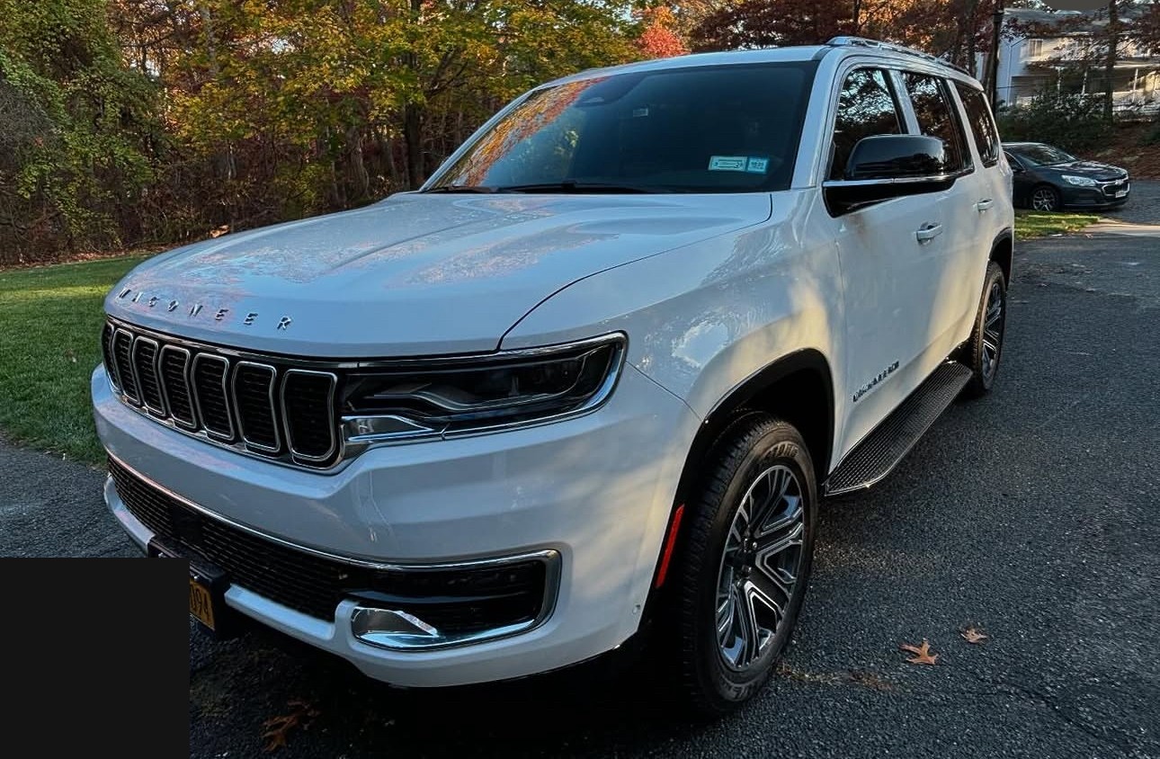 White Jeep Wagoneer front angle detail